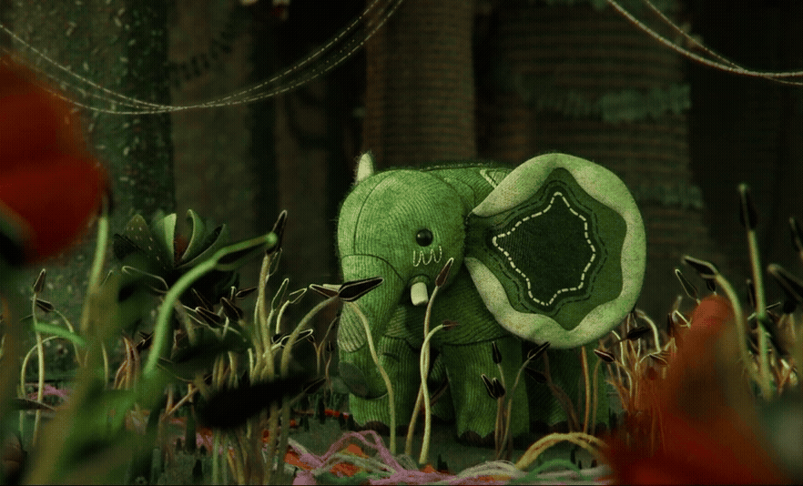 a gif from an animated film called "Au 8ème Jour" showing a green, patchwork elephant eating plants