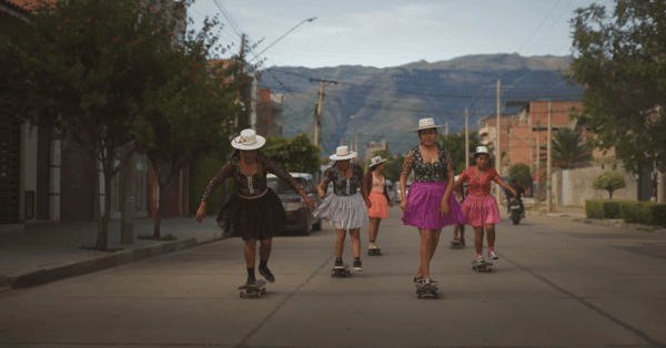 a gif of Quechuan women skateboarding
