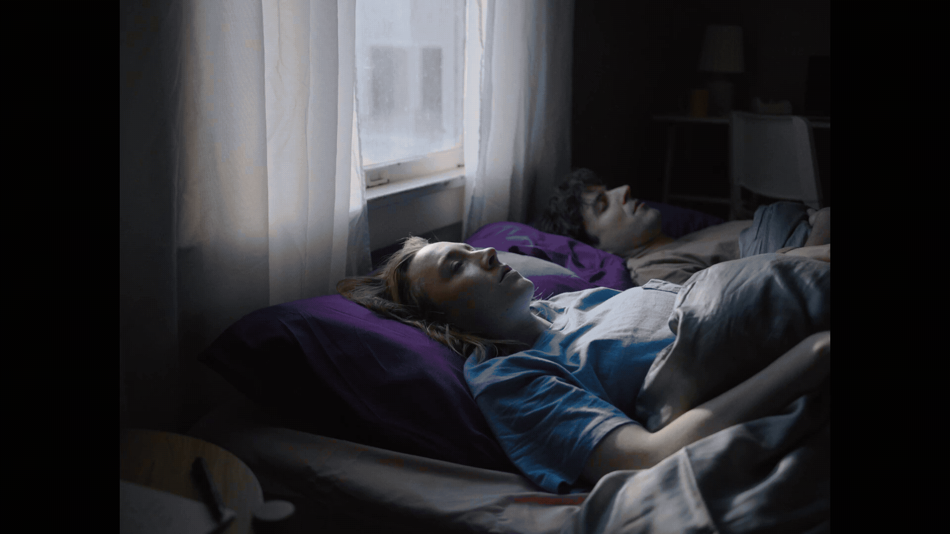 a gif from a music video of Saoirse Ronan plying a woman going through a daily routine