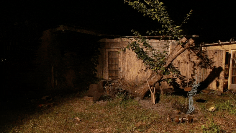 a gif of drawings circling a house in a film by Swoon