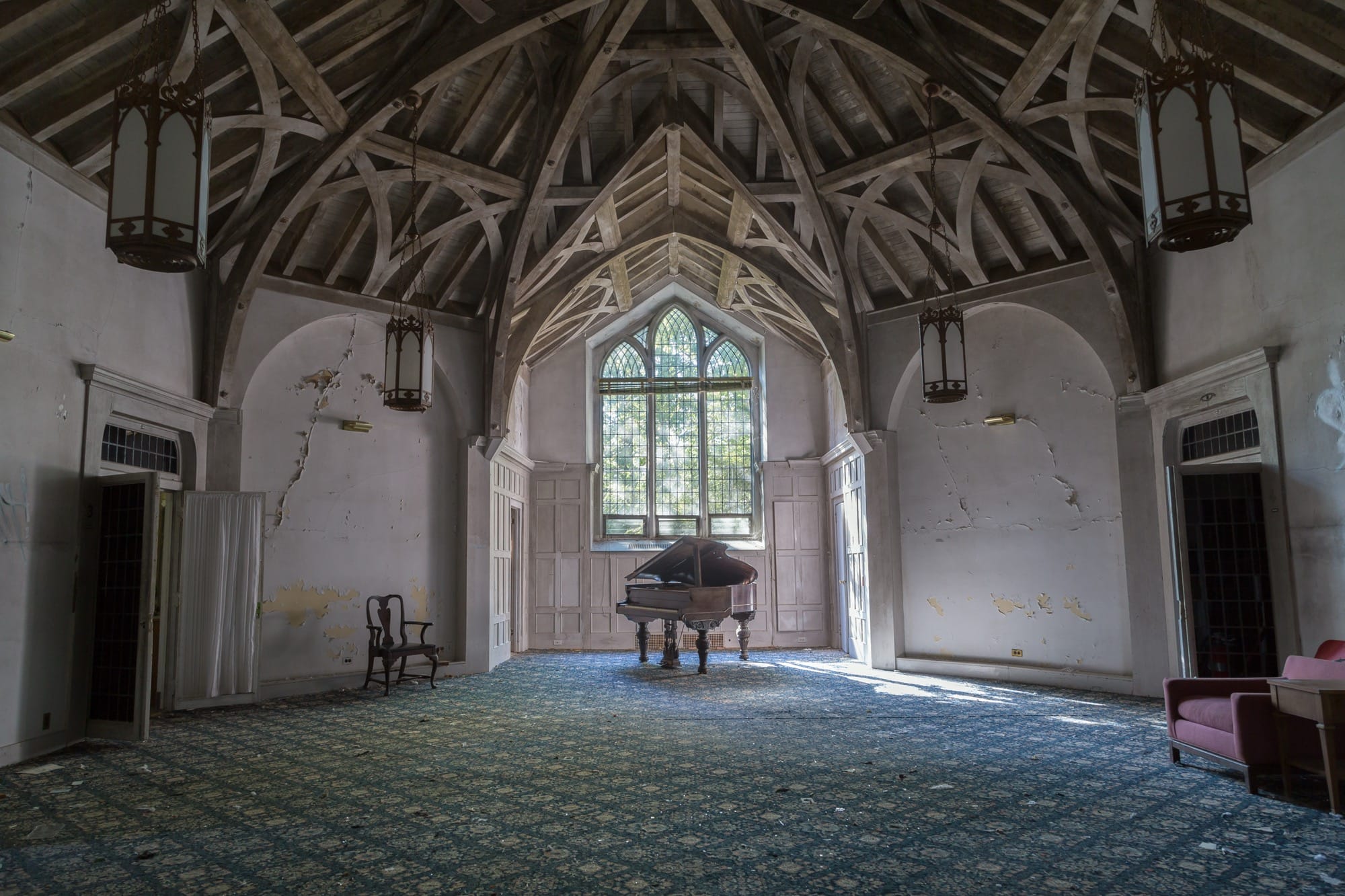 a photo of a large, vaulted room inside an abandoned house by Bryan Sansivero