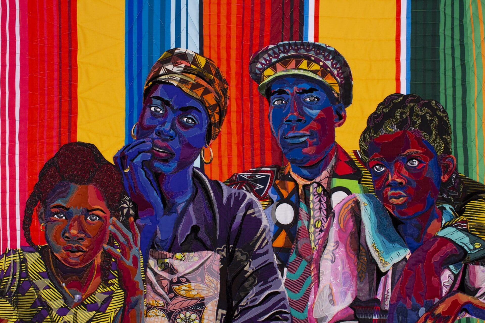 a vibrant quilt portrait of a family of four by bisa butler