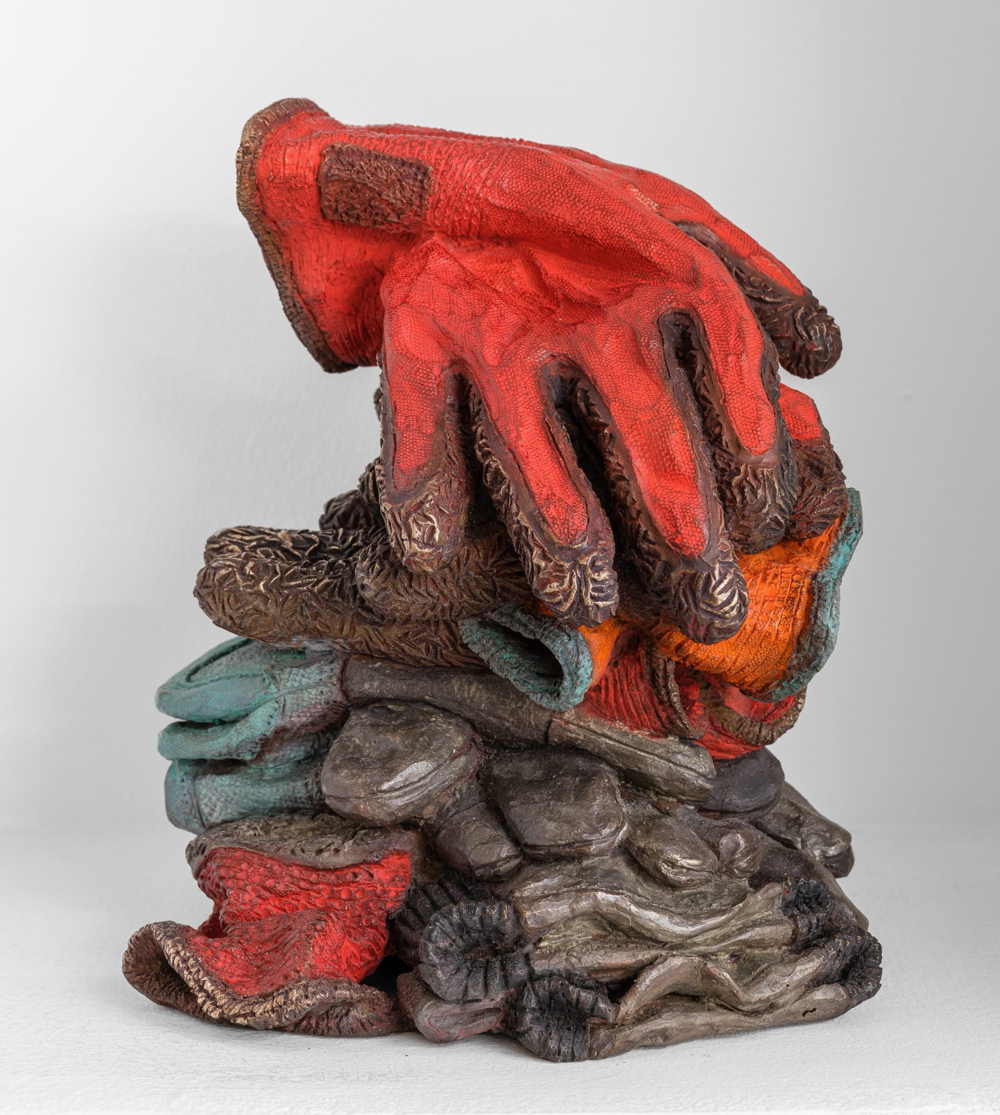 a sculpture by Ninon Hivert that mimics a stack of discarded work gloves