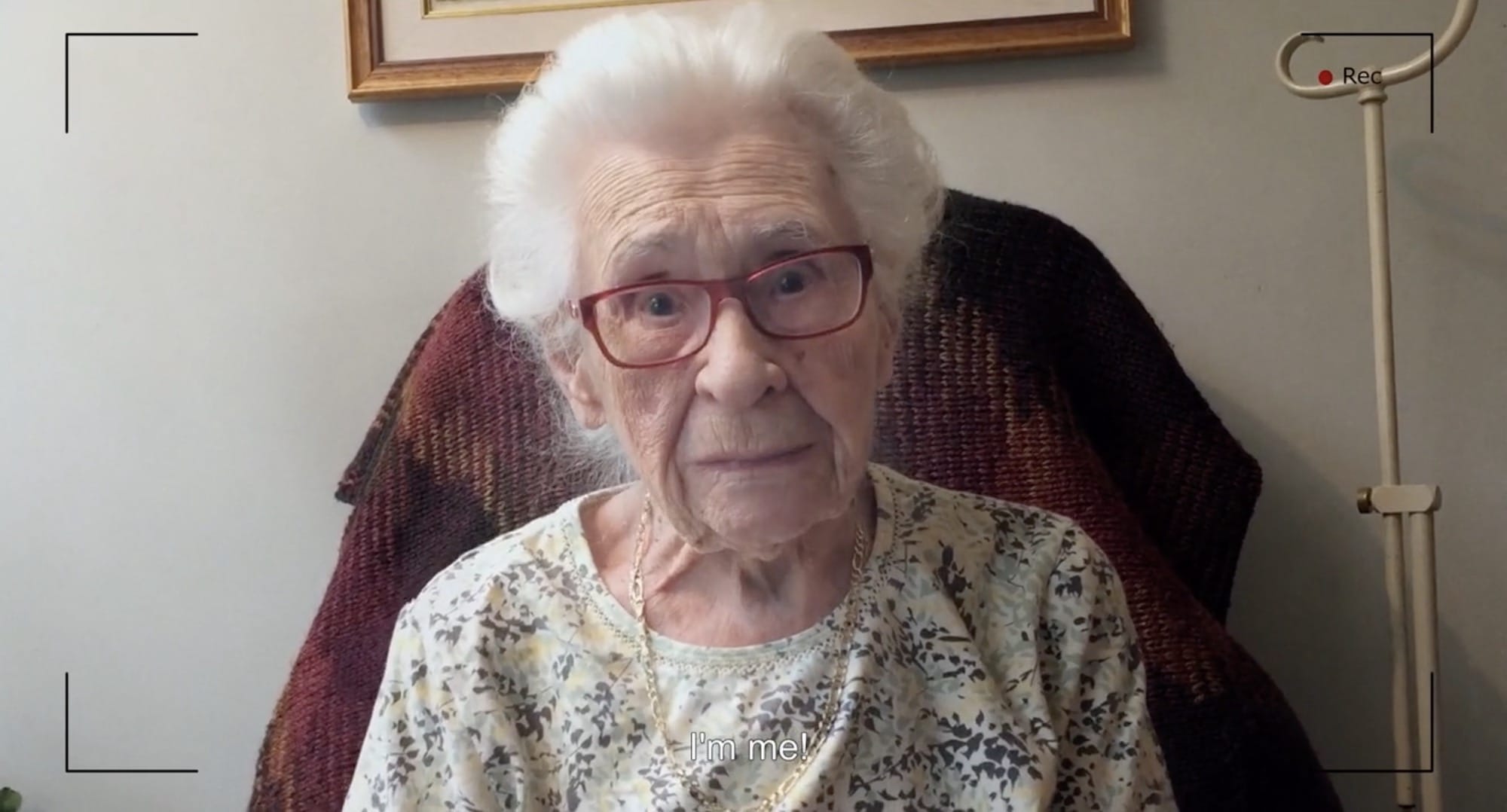 a still from the short animated film "Madeleine" by Raquel Sancinetti, featuring the real-life woman named Madeleine and a quote reading "I'm me!"