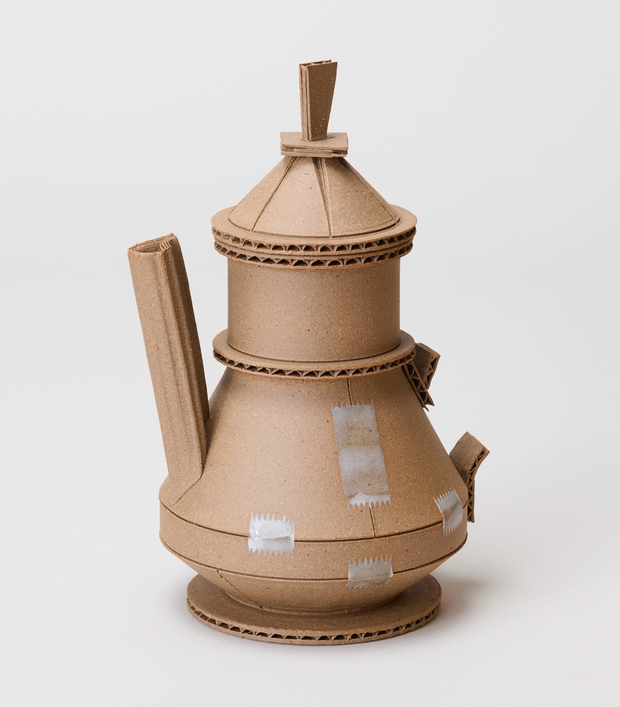 a ceramic pot by Jacques Monneraud that resembles cardboard with tape