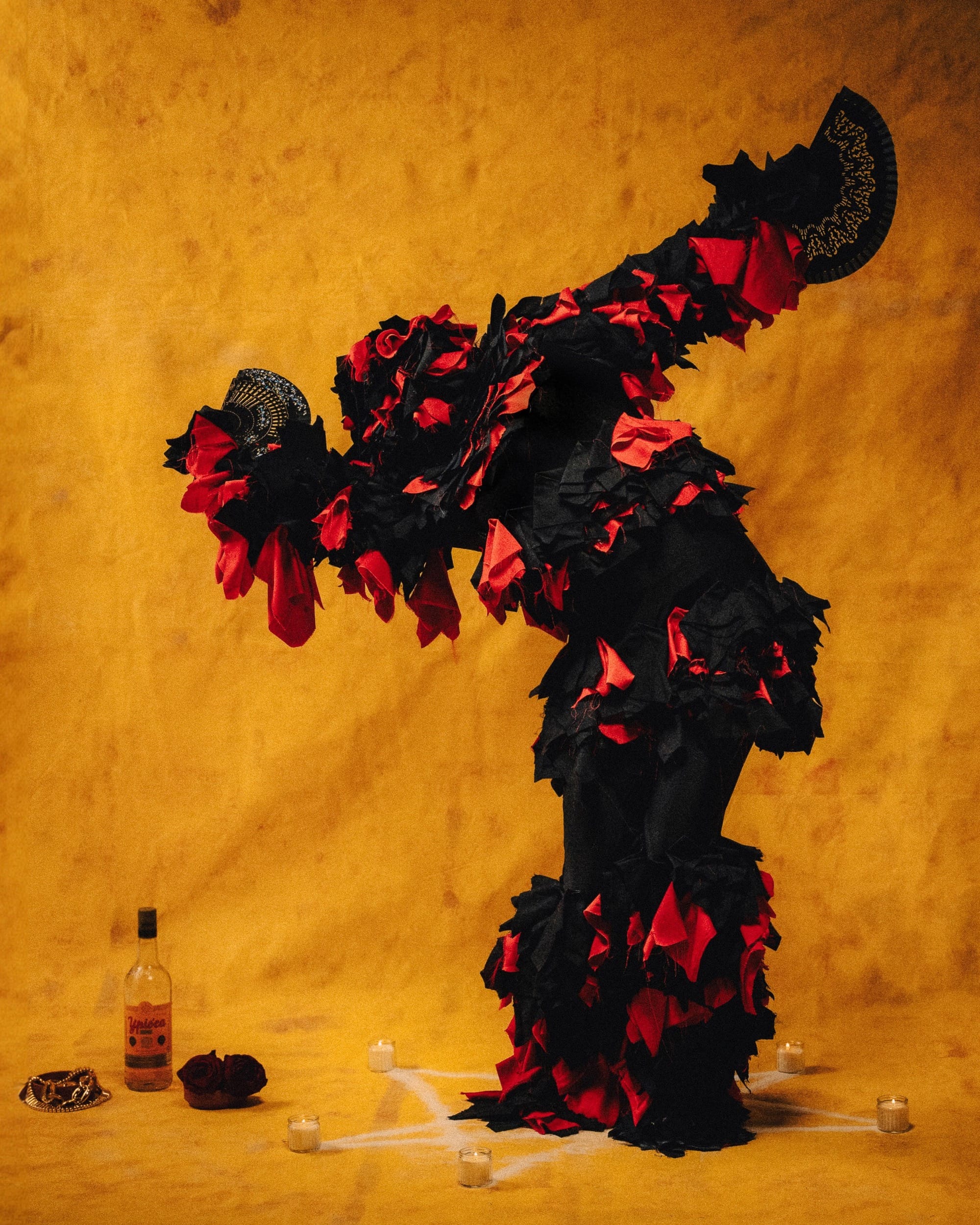 a costumed figure dancing against a yellow background